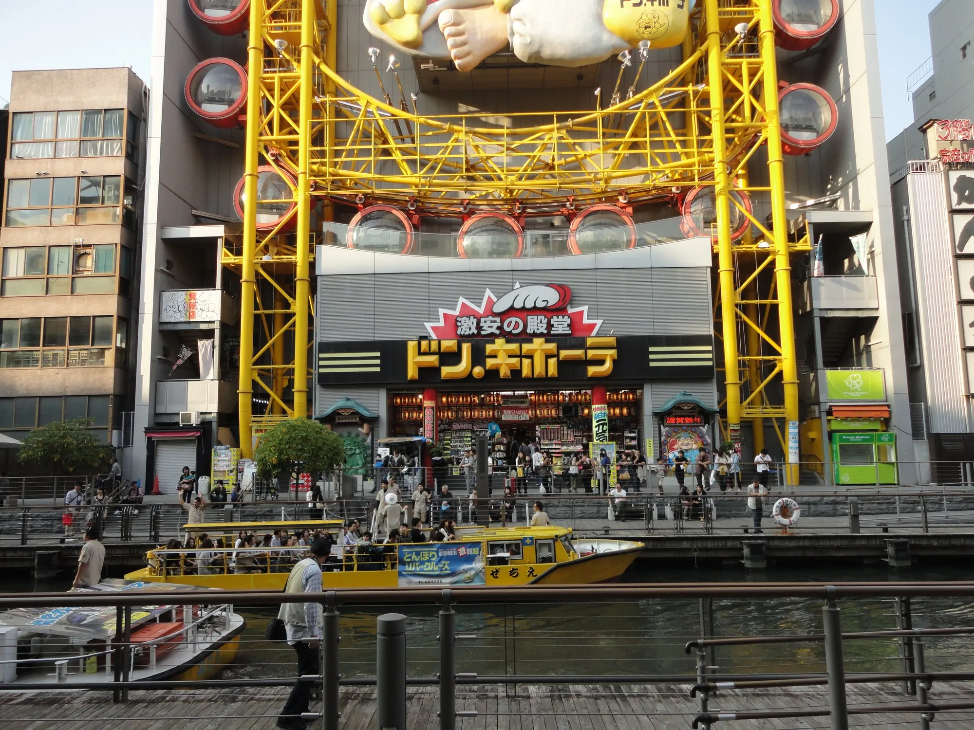 Don Quijote Dotonbori with its yellow Ferris wheel above the canal