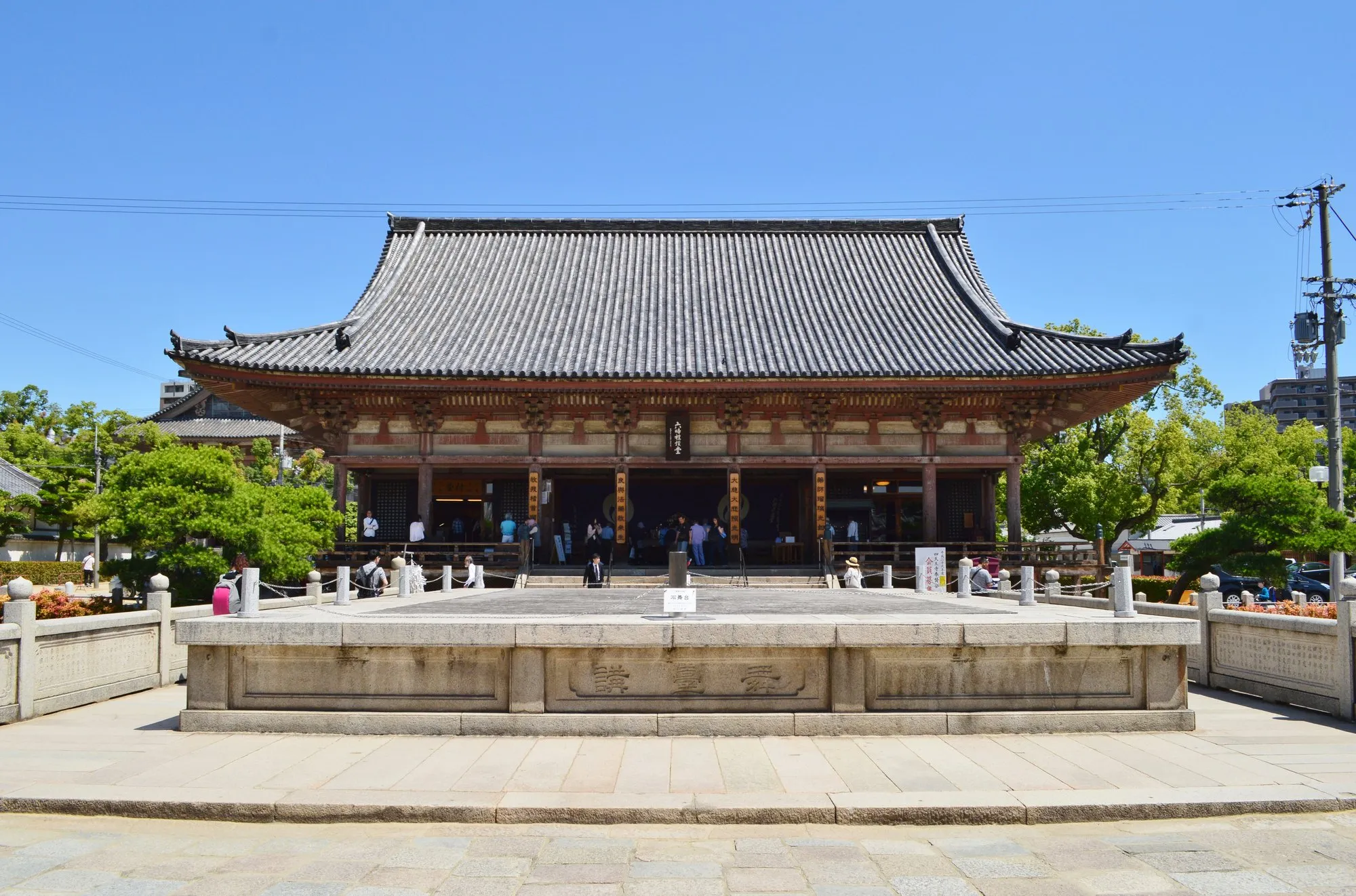 The Rokuji-do hall and stone stage at Shitennoji